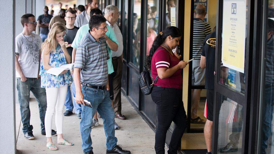 Customers wait to get in to the Division of Motor Vehicles office on Spring Forest Road in Raleigh last month. The DMV doesn’t begin to measure how long customers wait in line at its driver’s license offices until they get a ticket and take a seat inside.
