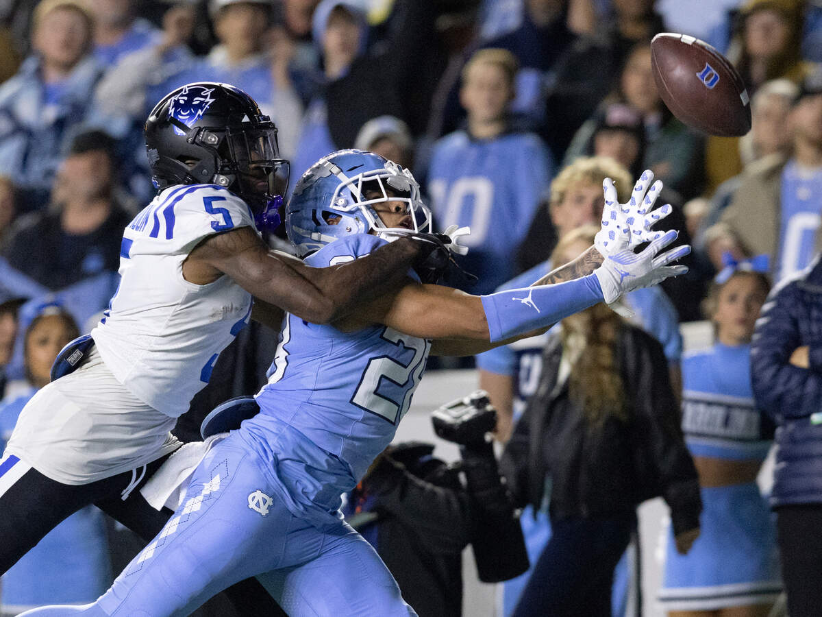 North Carolina’s Alijah Huzzie pressures a pass intended for Duke’s Jalon Calhoun during the second half of the Blue Devils’ 47-45 loss on Saturday, Nov. 11, 2023, at Kenan Stadium in Chapel Hill, N.C.