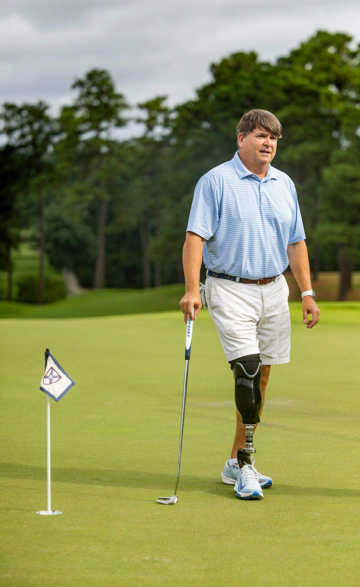 Garrett Smyth, 55, plays a round of golf on Wednesday, July 2, 2025, at Carolina Country Club in Raleigh. Smyth will compete in the U.S. Adaptive Open for the first time this week in Maryland. A four-time bone cancer survivor, he had his right leg amputated below the knee in 2023 and rediscovered his love for competitive golf.