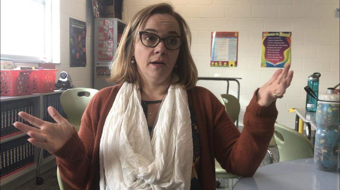 Jasmine Lauer, an English teacher at Pine Hollow Middle School in northwest Raleigh, gestures during an interview in her classroom about state spending on teacher pay, school supplies and more.