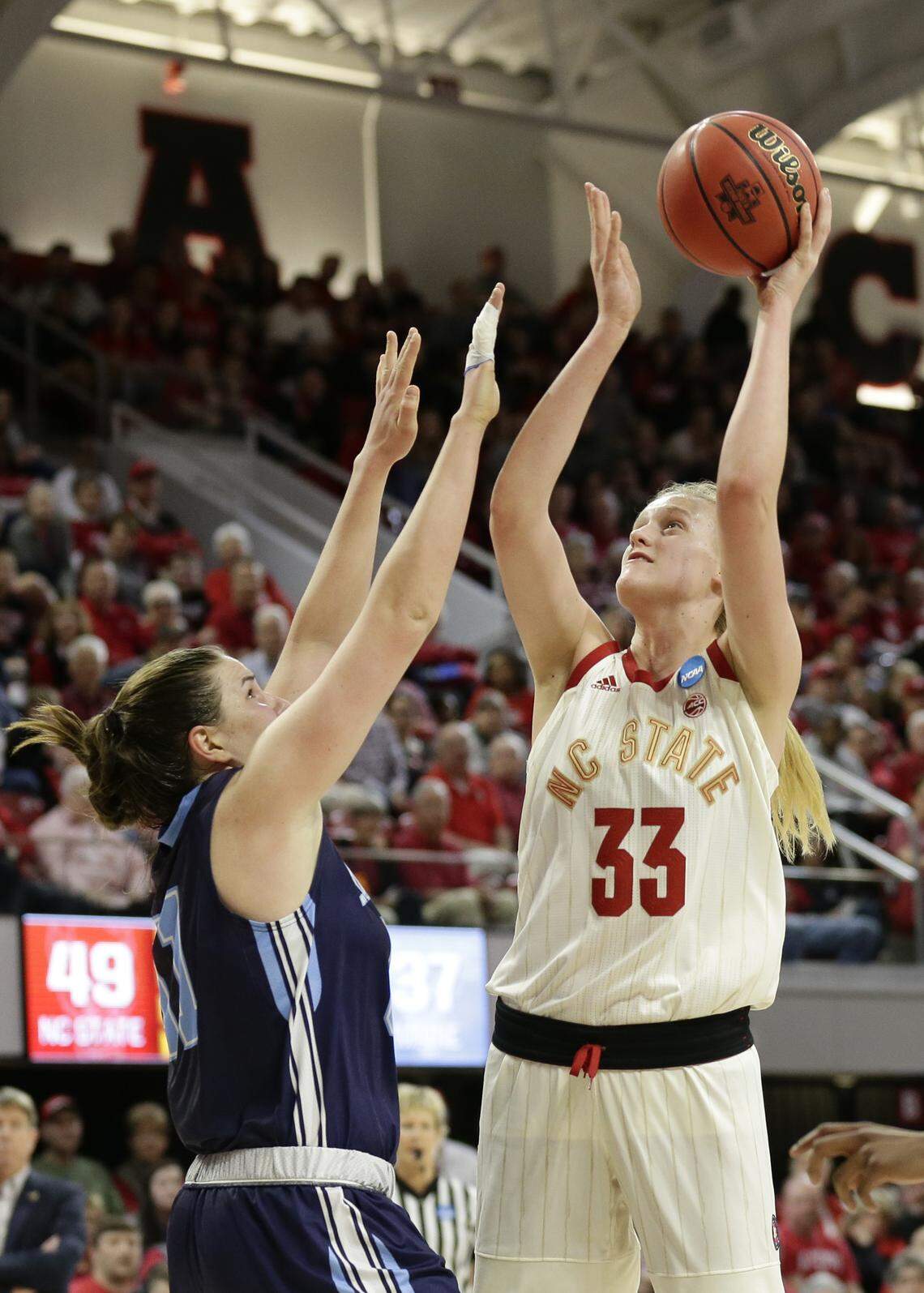 Maine’s Fanny Wadling defends against North Carolina State’s Elissa Cunane (33) during the second half of a first round women’s college basketball game in the NCAA Tournament in Raleigh, N.C., Saturday, March 23, 2019.