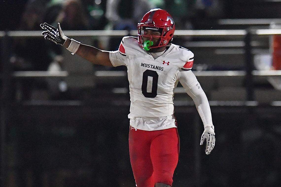 Middle Creek running back Jayden Spencer (0) reacts after getting the first down against Cary during the first half. The Cary Imps and the Middle Creek Mustangs met in a conference football game in Cary, N.C. on October 24, 2025