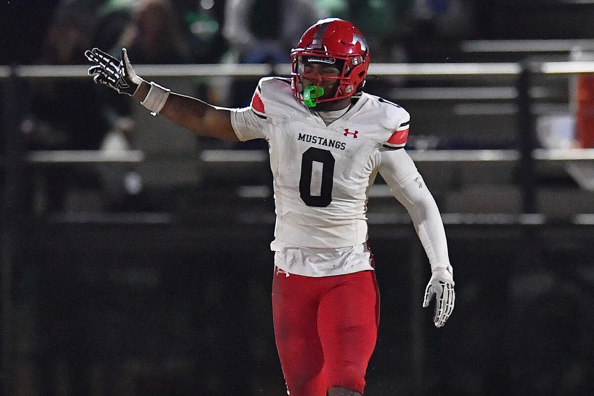 Middle Creek running back Jayden Spencer (0) reacts after getting the first down against Cary during the first half. The Cary Imps and the Middle Creek Mustangs met in a conference football game in Cary, N.C. on October 24, 2025
