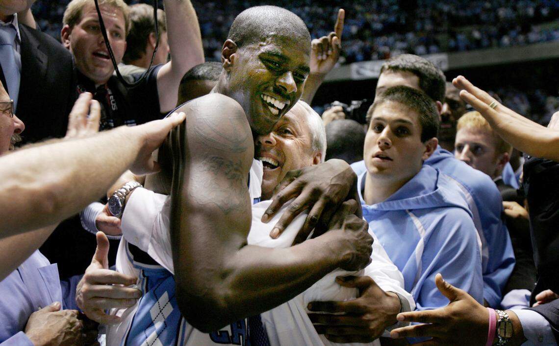 UNC’s Marvin Williams celebrates the Tar Heels 75-73 win over Duke in 2005 with head coach Roy Williams.