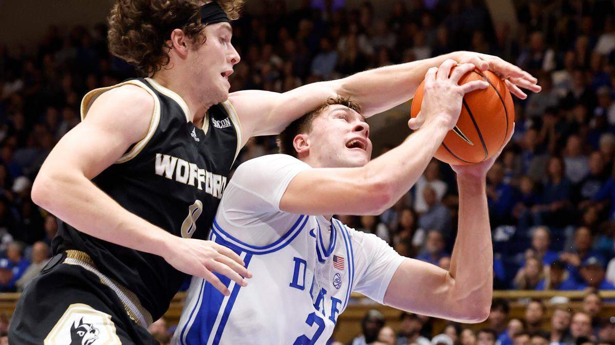 Duke’s Cooper Flagg (2) is fouled by Wofford’s Jackson Sivills (0) while making the shot during the first half of Duke’s game against Wofford at Cameron Indoor Stadium in Durham, N.C., Saturday, Nov. 16, 2024.