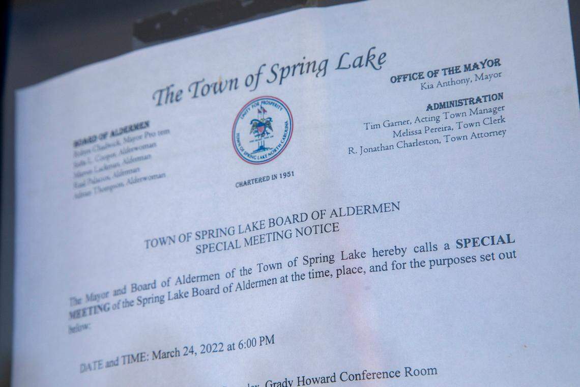 A notice of a special board of aldermen meeting is taped to the door of the Spring Lake Municipal Building Friday March 25, 2022. The town of Spring Lake is missing nearly $500,000 after hiring a finance director with personal bankruptcies, tax liens and no resume.