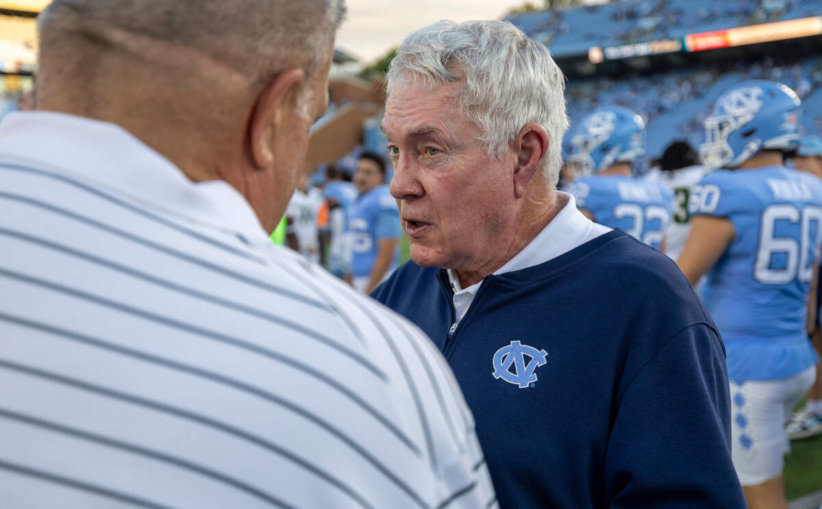 North Carolina coach Mack Brown talks with Charlotte head coach Biff Poggi following the Tar Heels’ 38-20 victory on Saturday, September 7, 2024 at Kenan Stadium in Chapel Hill, N.C.