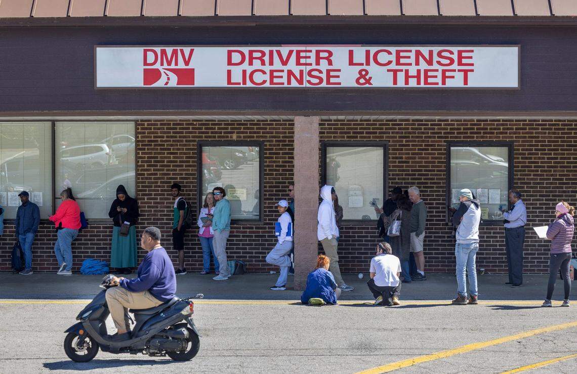 More than 40 people wait in line at the North Carolina DMV Driver’s License Office on Avent Ferry Road on Wednesday afternoon, April 10, 2025 in Raleigh, N.C. Most arrived well before 9 a.m. seeking a spot in the first come, first served line. Many said they had been in line multiple days seeking service, since online appointments are booked well into the months ahead.