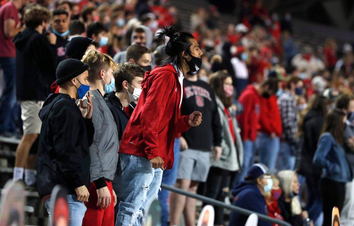 Wolfpack fans cheer for the team during the first half of N.C. State’s game against Liberty at Carter-Finley Stadium in Raleigh, N.C., Saturday, Nov. 21, 2020.