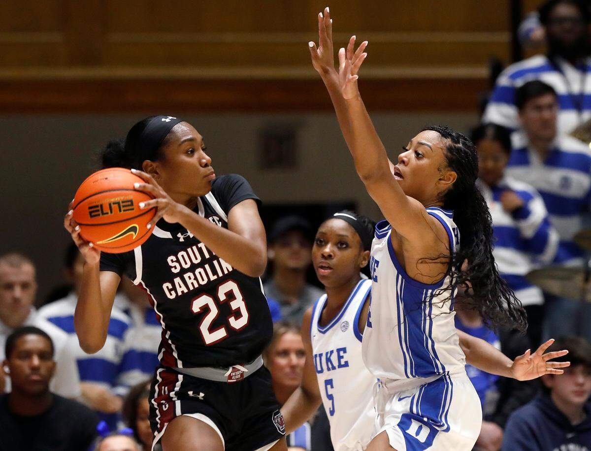 Duke’s Oluchi Okananwa and Reigan Richardson pressure South Carolina’s Bree Hall during the second half of the Blue Devils’ 77-61 loss on Sunday, Dec. 3, 2023, at Cameron Indoor Stadium in Durham, N.C.