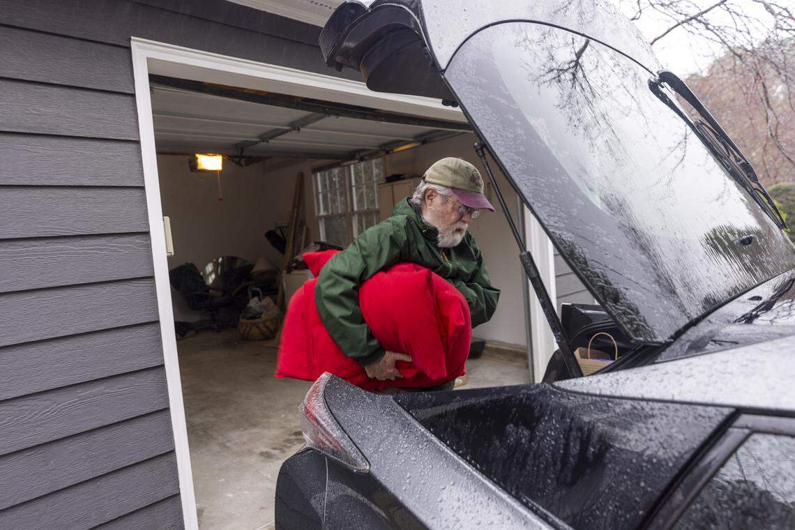 Peter Burke moves personal belongings into his newly renovated 1,380-square-foot home in the Weatherhill Pointe neighborhood in Carrboro. The house was flooded in July 2025 by Tropical Storm Chantal, which dumped 9 to 12 inches of rain in parts of central North Carolina.