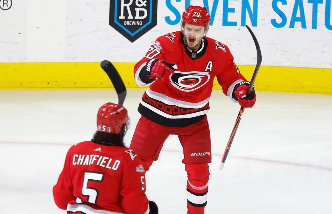 Carolina center Sebastian Aho (20) celebrates with defenseman Jalen Chatfield (5) after Chatfield scored during the first period of game two between the Hurricanes and Panthers in the Eastern Conference Finals at PNC Arena in Raleigh, N.C., Saturday, May 20, 2023.
