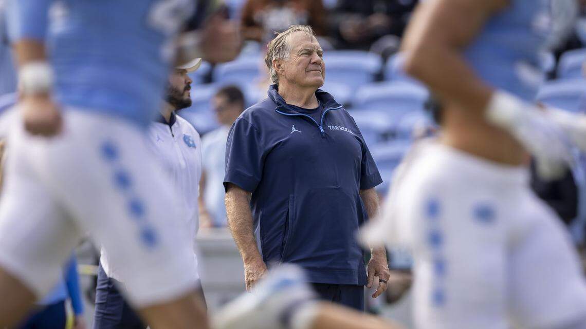 North Carolina coach Bill Belichick watches his team warm up for their game against Virginia on Saturday, October 25, 2025 at Kenan Stadium in Chapel Hill, N.C. 