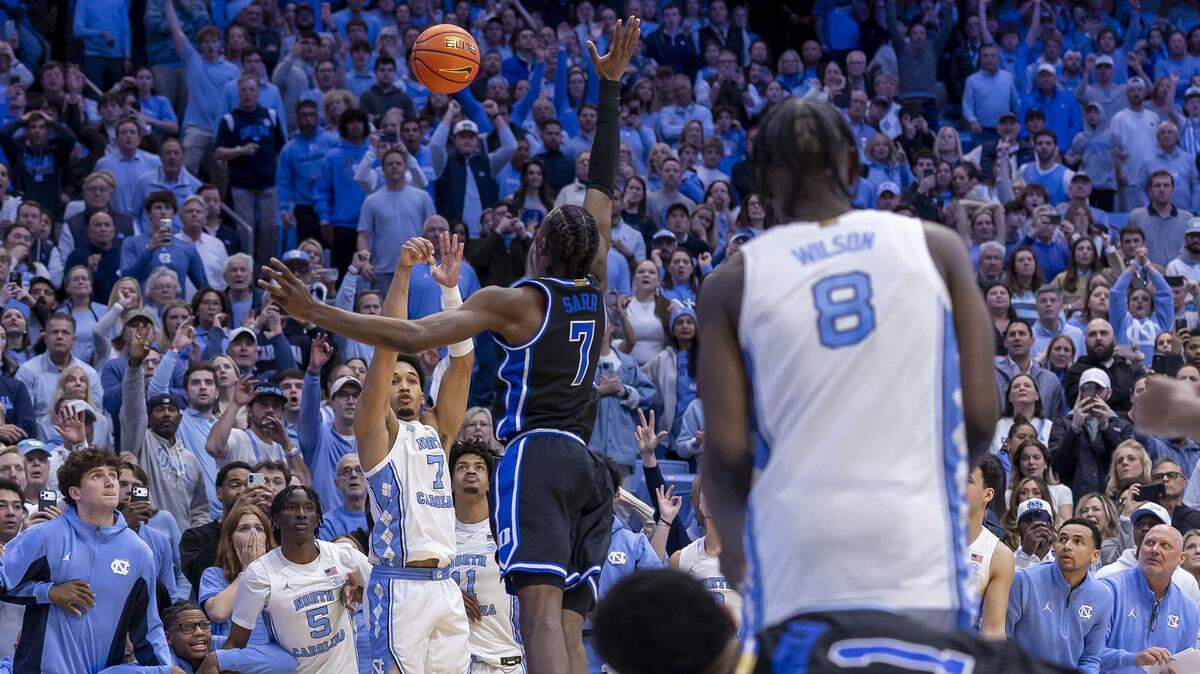 North Carolina guard Seth Trimble (7) launches a three-point shot with .4 seconds to play against Duke to win the game 71-68 on Saturday, February 7, 2026 at the Smith Center in Chapel Hill, N.C.
