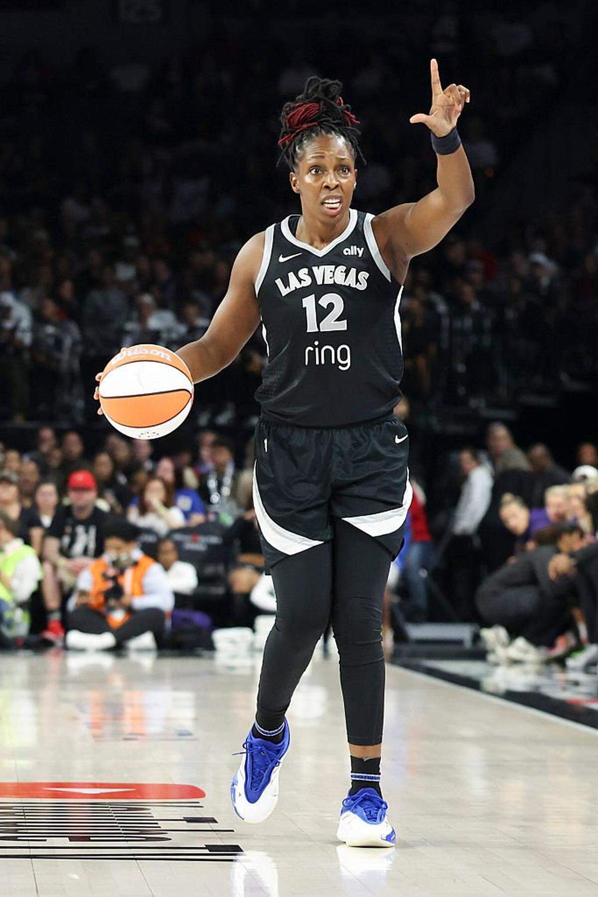 LAS VEGAS, NEVADA - OCTOBER 05: Chelsea Gray #12 of the Las Vegas Aces dribbles up court in the second quarter of Game Two of the 2025 WNBA Playoffs finals against the Phoenix Mercury at Michelob ULTRA Arena on October 05, 2025 in Las Vegas, Nevada. (Photo by Ian Maule/Getty Images)