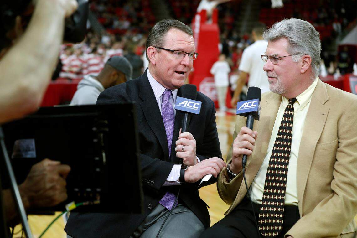Wes Durham and Mike Gminski, right, talk before N.C. State’s game against Georgia Tech at PNC Arena in Raleigh, N.C., Wednesday, March, 6, 2019.