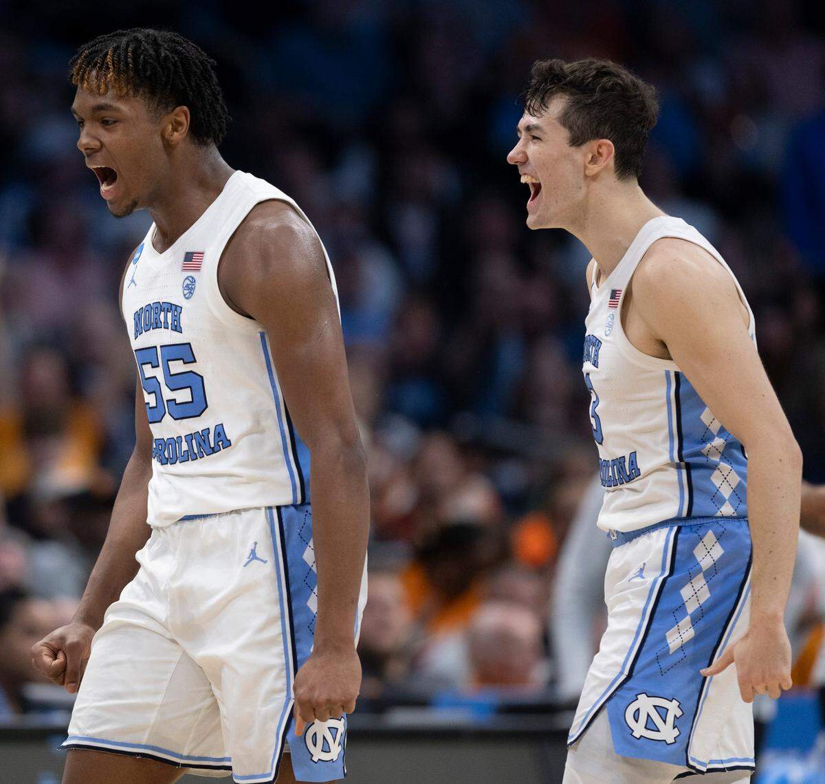 North Carolina’s Harrison Ingram (55) and Cormac Ryan (3) react after Ingram sank a three-point basket to secure a 69-57 lead over Michigan State in the second half on Saturday, March 23, 2024 in the second round of the NCAA Tournament at Spectrum Center in Charlotte, N.C.