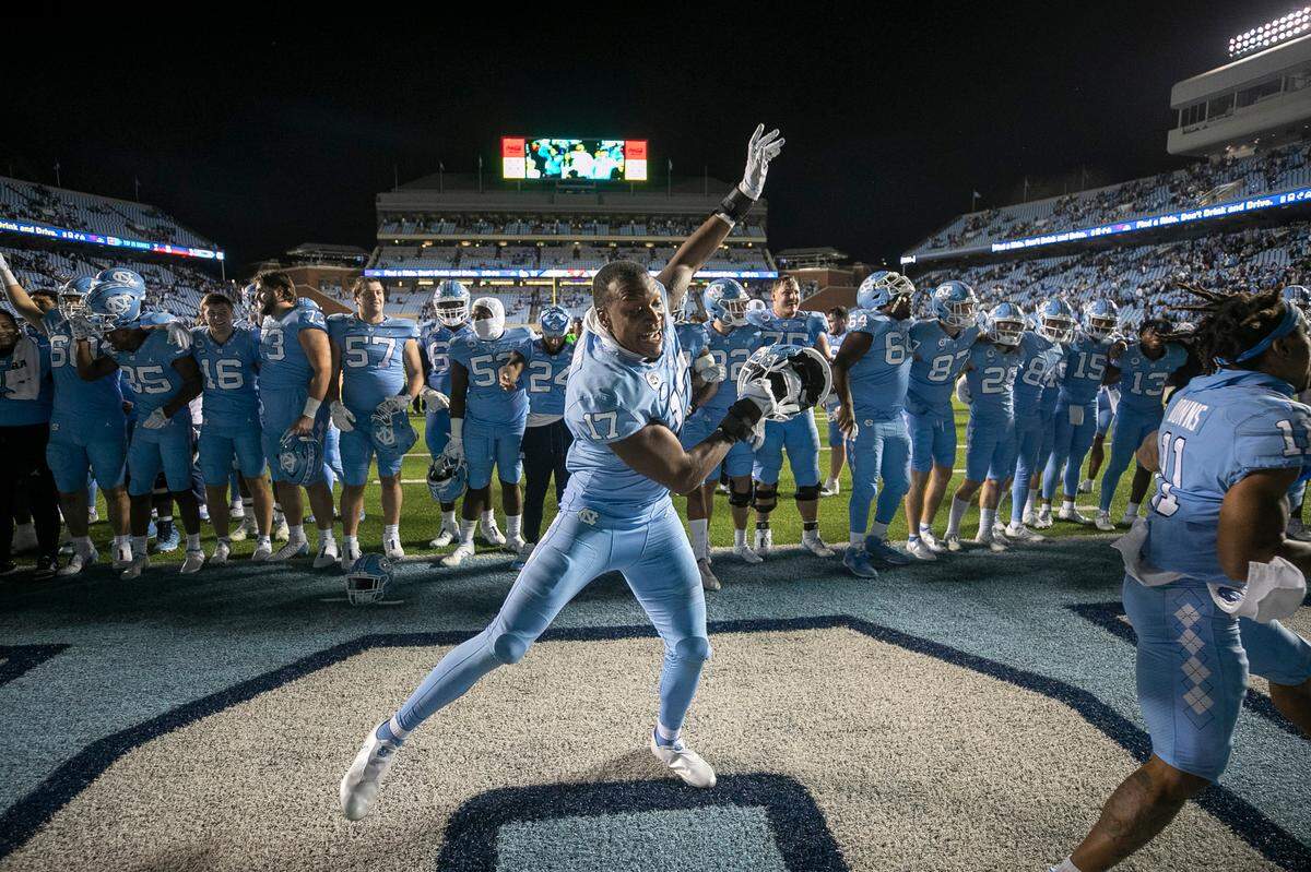 North Carolina’s Chris Collins (17) celebrates with his teammates following the Tar Heels’ 42-24 victory over Pitt on Saturday, October 29, 2022 at Kenan Stadium in Chapel Hill, N.C.