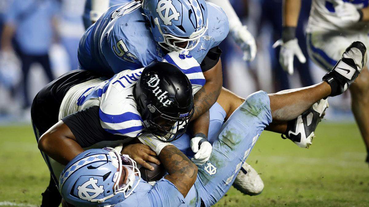 Duke’s Aaron Hall sacks North Carolina quarterback Gio Lopez during the second half of the Blue Devils’ 32-25 victory on Saturday, Nov. 22, 2025, at Kenan Stadium in Chapel Hill, N.C.
