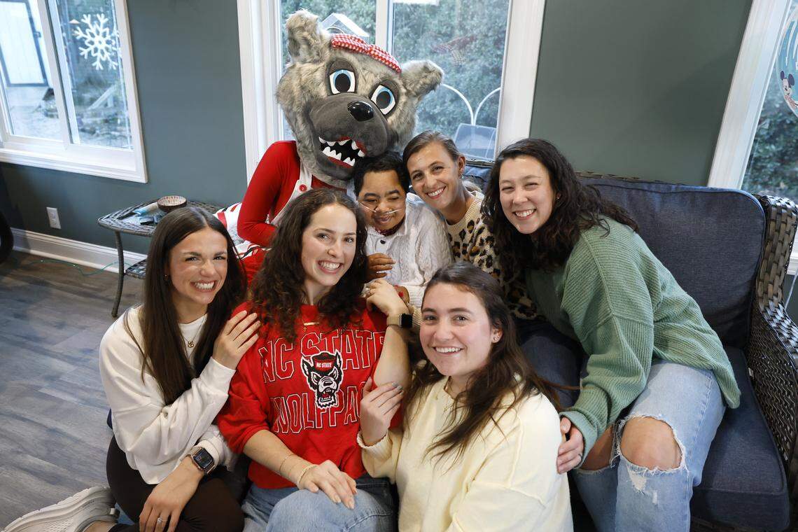 Ms. Wuf and former Ms. Wufs gather for a portrait with Grayson Ketchie during a party for him in Garner on Saturday, Jan. 17, 2026.