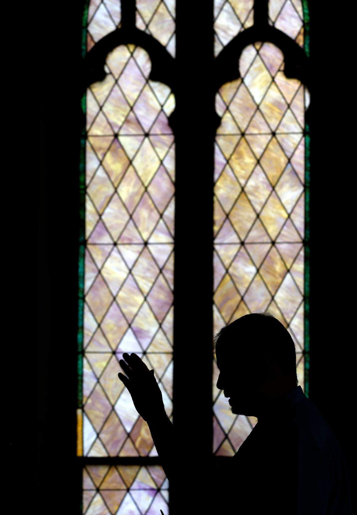 Mark Hipps-Figgs offers a prayer request during a service of Elizabeth Street United Methodist Church on Sunday, July 31, 2022, in Durham, N.C. Mark and Maxie Hipps-Figgs were the first gay couple to be publicly married in a North Carolina United Methodist Church.