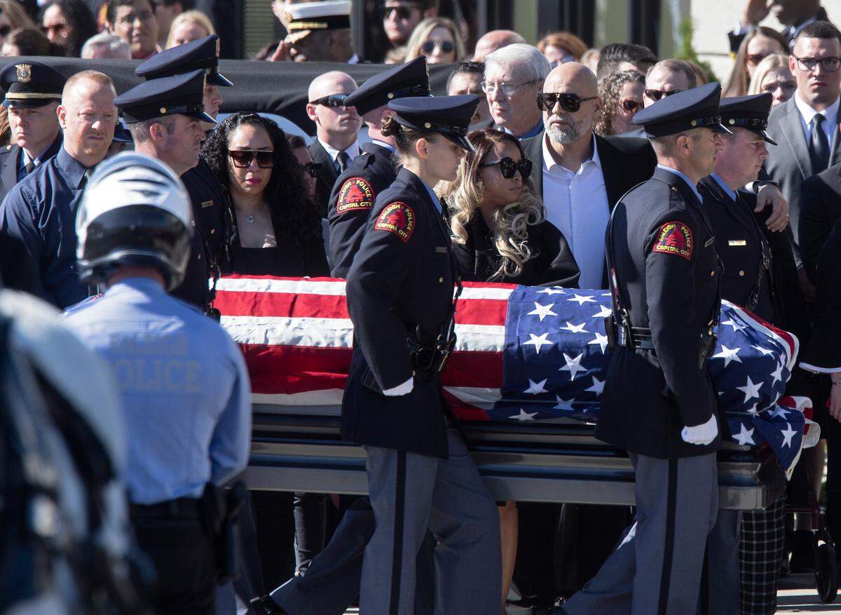 The casket of Raleigh police officer Gabriel Torres is carried into Cross Assembly Church on Saturday, Oct. 22, 2022, in Raleigh, N.C. Torres, 29, was one of five people fatally shot near the Hedingham neighborhood on Oct. 13.