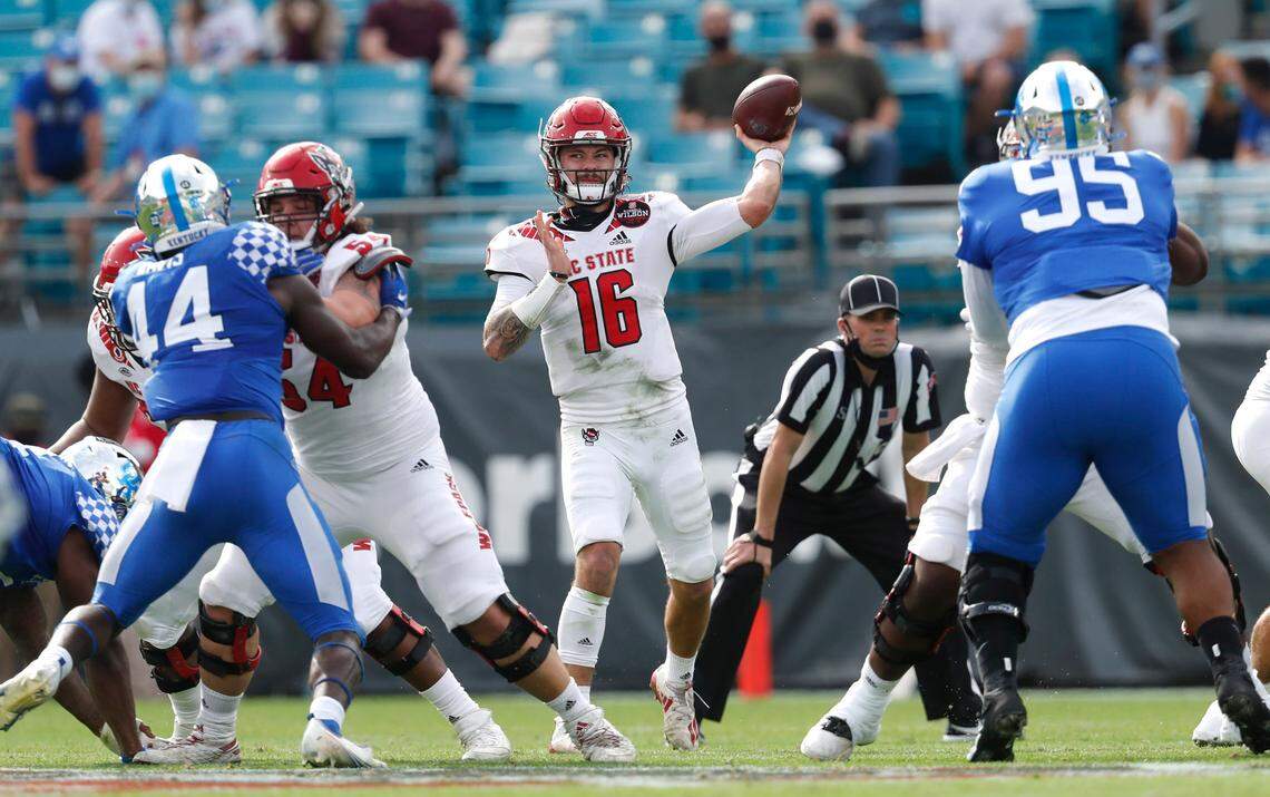 N.C. State quarterback Bailey Hockman (16) passes during the first half of N.C. State’s game against Kentucky in the Gator Bowl at TIAA Bank Field in Jacksonville, Fla., Saturday, January 2, 2021.