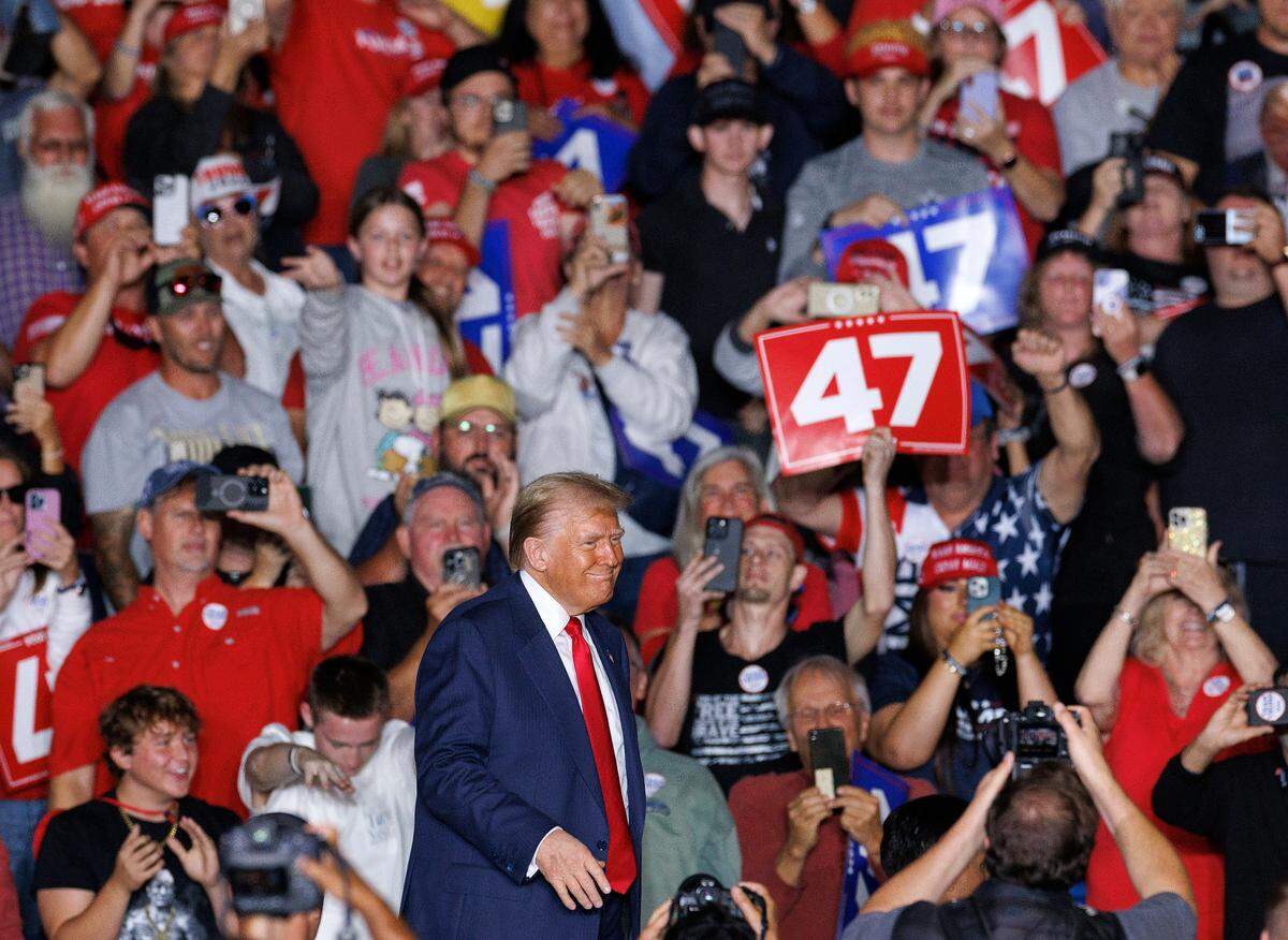 Former President Donald Trump smiles at the conclusion of a rally at the Greensboro Coliseum Complex on Tuesday, Oct. 22, 2024, in Greensboro, N.C.