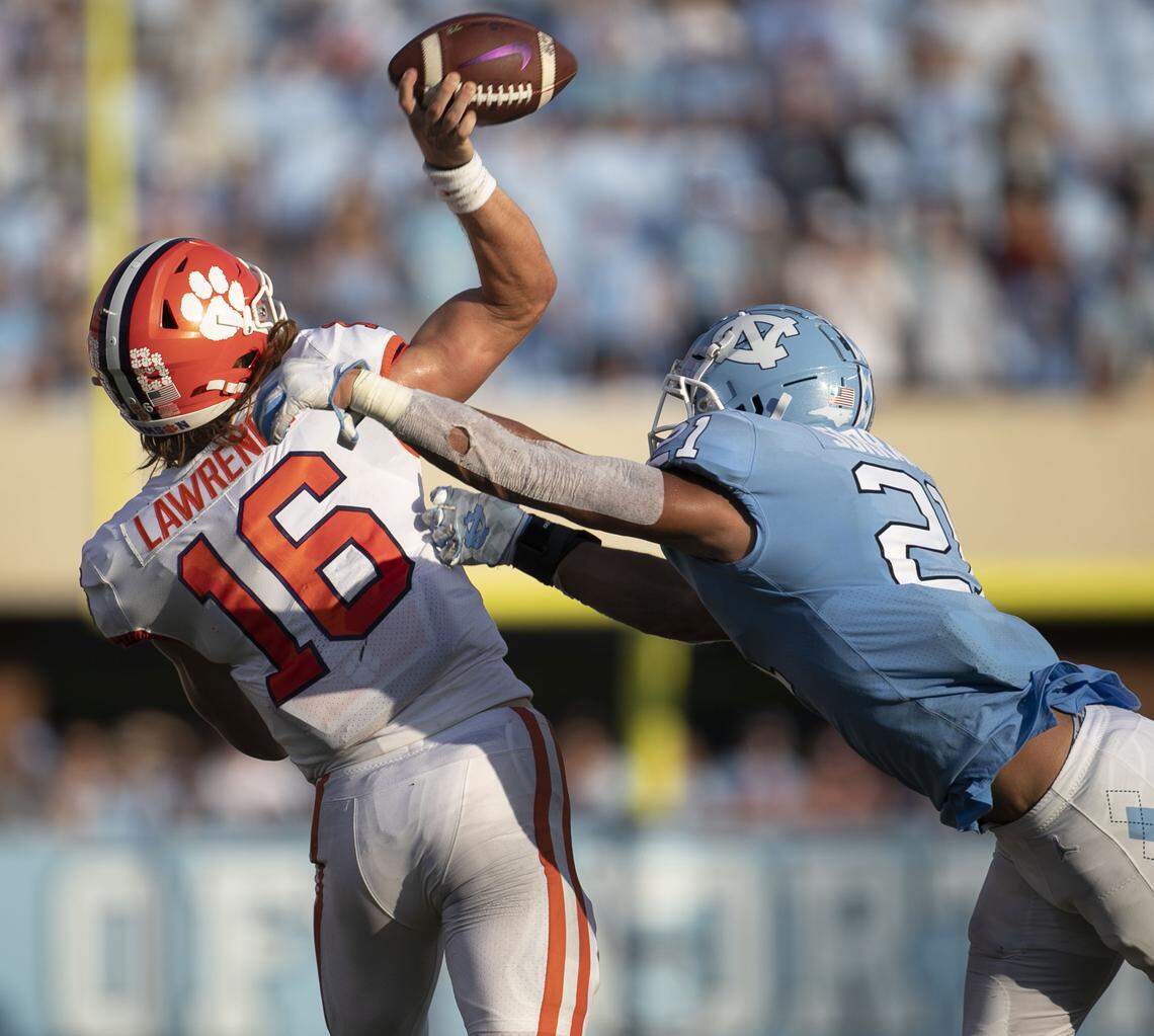 North Carolina linebacker Chazz Surratt (21) pressures Clemson quarterback Trevor Lawrence (16) in the third quarter on Saturday, September 28, 2019 at Kenan Stadium in Chapel Hill, N.C.