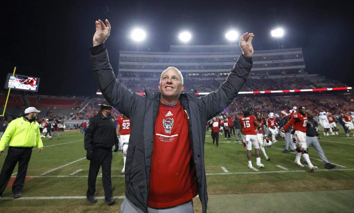 N.C. State head coach Dave Doeren celebrates after N.C. State’s 42-19 victory over UNC at Carter-Finley Stadium in Raleigh, N.C., Saturday, Nov. 29, 2025.