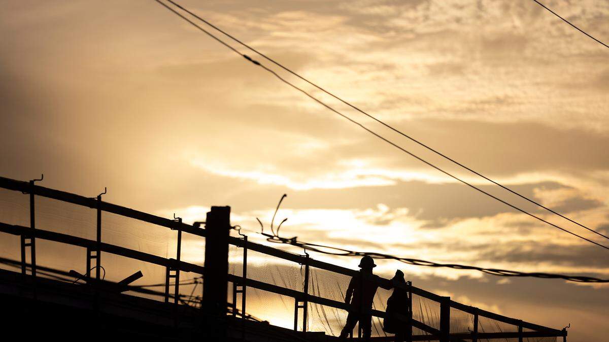 A person walks in the construction area for a new development on West Geer Street in Durham, N.C. on Tuesday, Feb. 7, 2023.