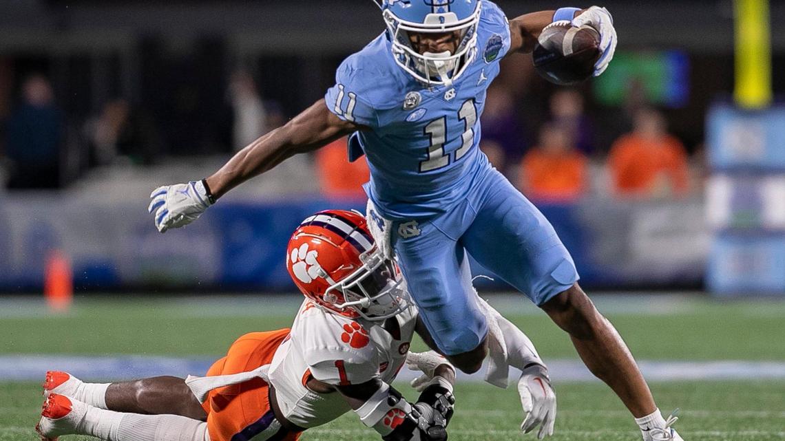 Clemson’s Cade Mukuba (1) works to stop North Carolina’s Josh Downs after an 11-yard gain on a pass reception from Drake Maye in the second quarter on Saturday, December 3, 2022 at Bank of American Stadium in Charlotte, N.C.