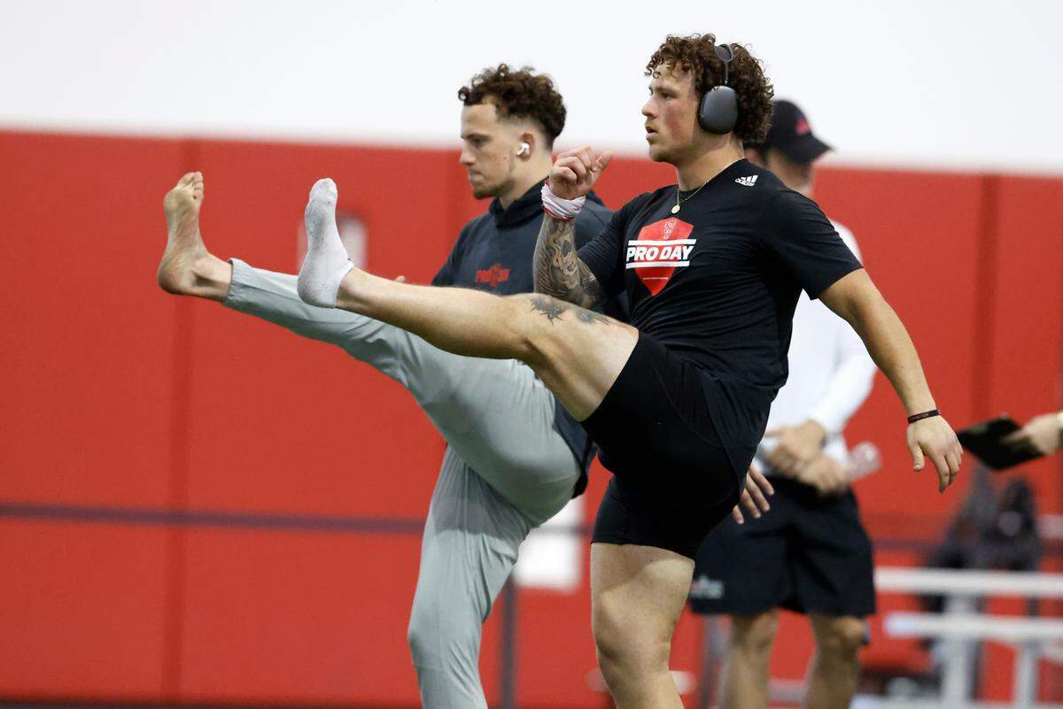 N.C. State’s Thayer Thomas and his brother Drake Thomas warm up before N.C. State’s Pro Day at the Close-King Indoor Facility in Raleigh, N.C., Tuesday, March 28, 2023.