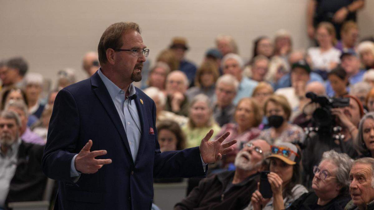 Congressman Chuck Edwards took questions from the crowd during a town hall on March 13, 2025 at A-B Tech's Ferguson Auditorium. Some 350 constituents from North Carolina's 11th congressional district packed the auditorium, with hundreds more protesting outside.
