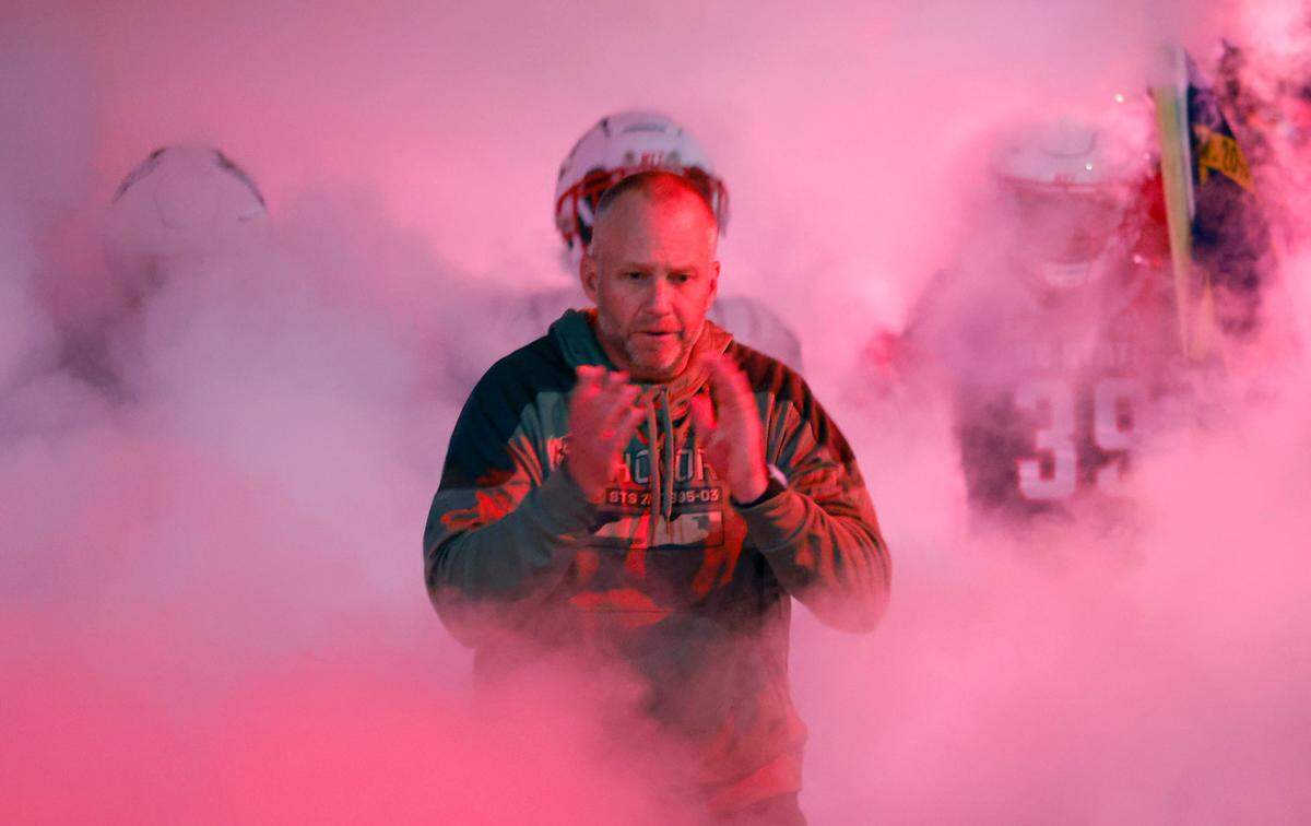 N.C. State head coach Dave Doeren heads onto the field with the team before N.C. State’s game against Virginia Tech at Carter-Finley Stadium in Raleigh, N.C., Thursday, Oct. 27, 2022.