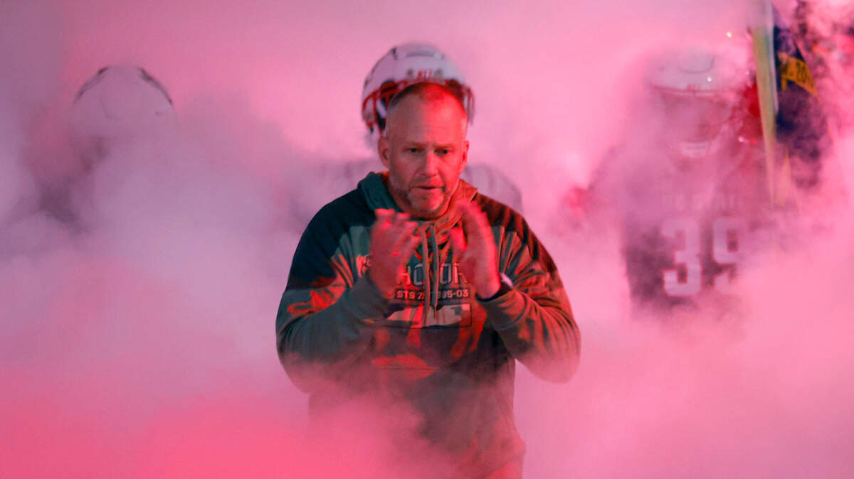 N.C. State head coach Dave Doeren heads onto the field with the team before N.C. State’s game against Virginia Tech at Carter-Finley Stadium in Raleigh, N.C., Thursday, Oct. 27, 2022.
