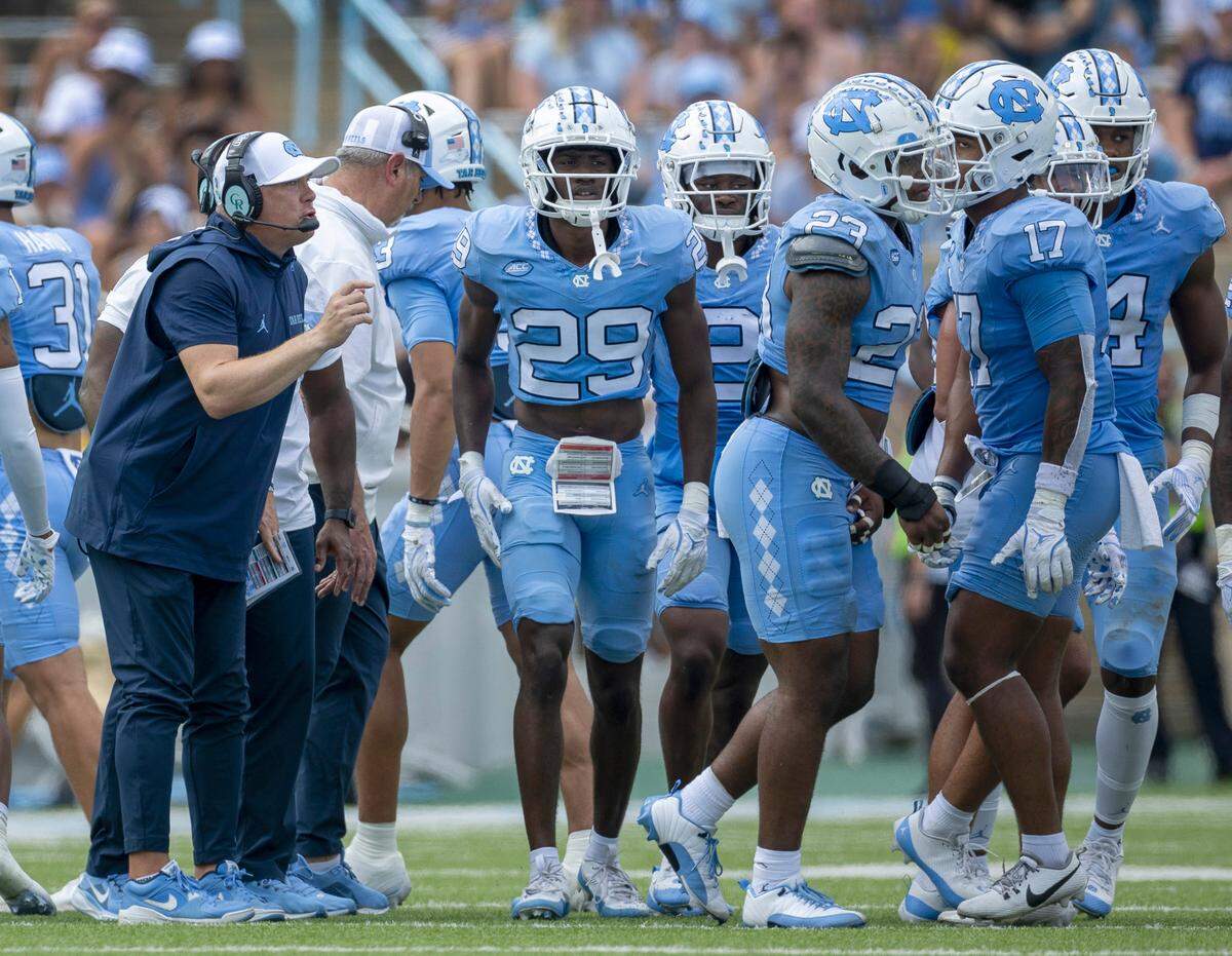 Down by 25 points to James Madison in the second quarter, North Carolina defensive coordinator Geoff Collins talks with his unit on Saturday, September 21, 2024 at Kenan Stadium in Chapel Hill, N.C.