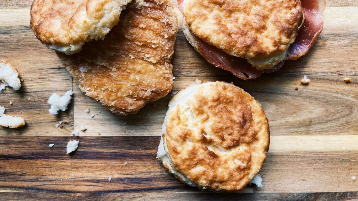 The iconic fast-food chain Bojangles, based in Charlotte, is known for its chicken sandwiches and biscuits. Pictured are a cajun fillet biscuit (left), a country ham biscuit (right), and a plain made-from-scratch biscuit (bottom).
