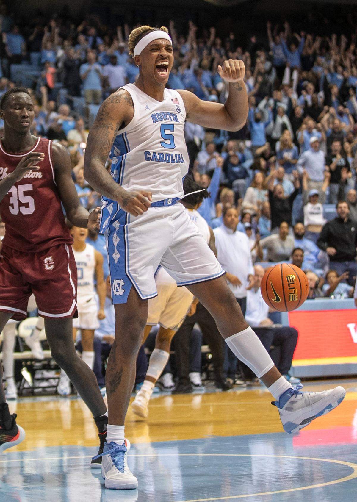 North Carolina’s Armando Bacot (5) reacts after a dunk over College of Charleston’s Babacar Faye (35) in the second half on Friday, November 11, 2022 at the Smith Center in Chapel Hill, N.C. Bacot lead all scores with 28 points in the Tar Heels’ 102-86 victory.