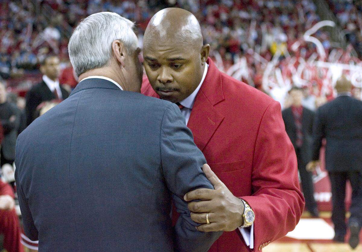 UNC coach Roy Williams huddles with N.C. State coach Sidney Lowe prior to their game on Saturday February 3, 2007 in Raleigh.