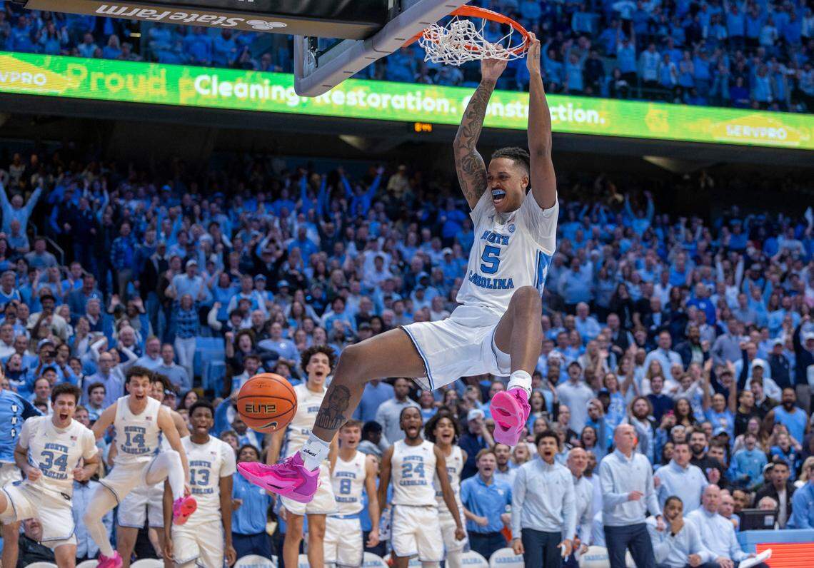 North Carolina’s Armando Bacot (5) gets a dunk on a fast break to secure the Tar Heels’ 93-84 victory with ten seconds to play against Duke on Saturday, February, 3, 2024 at the Dean E. Smith Center in Chapel Hill, N.C. Bacot led all scores with 25 points.