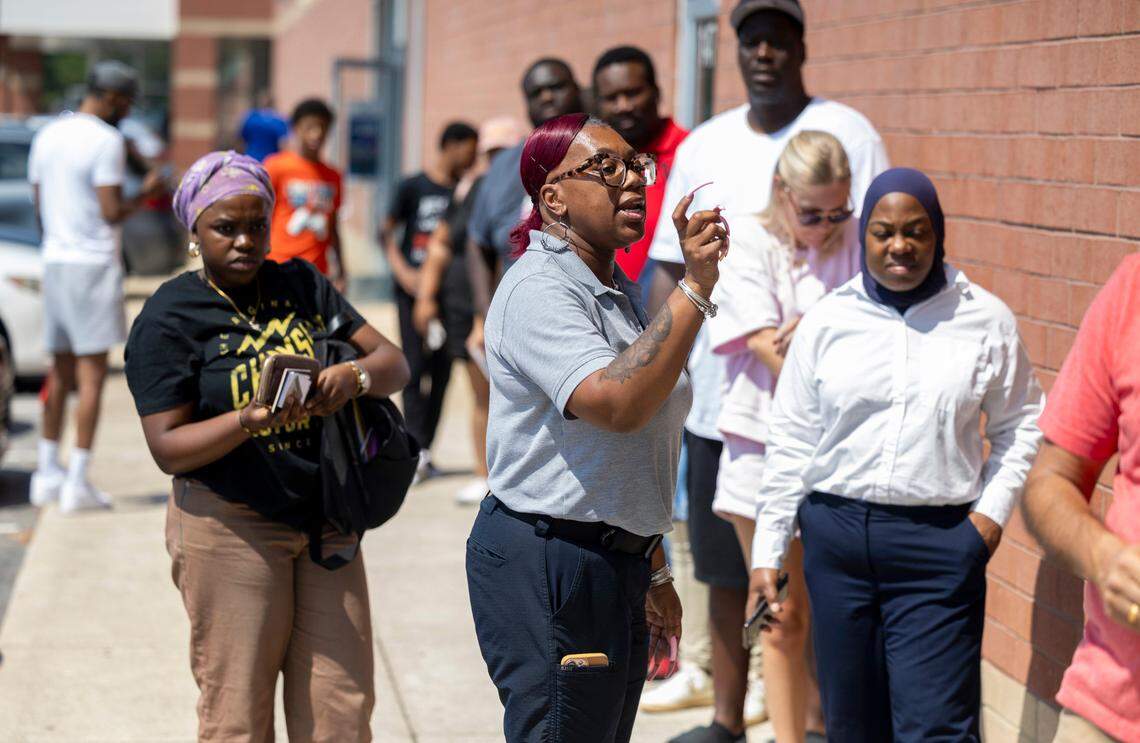 Supervisor Tanika Williams check drivers’ paperwork outside the NCDMV driver license office on New Bern Avenue in Raleigh on Thursday, Aug. 29, 2024.