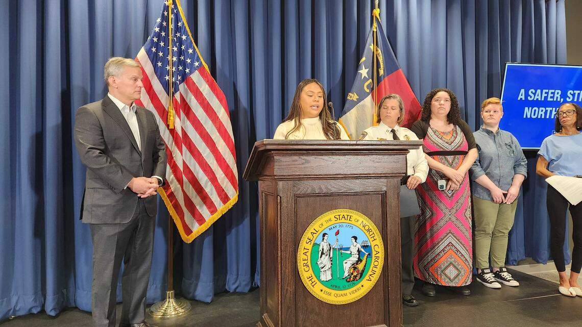 “Pass a budget that honors our work,” Rachel Candaso, the North Carolina 2025 Teach of the Year, said during a news conference with Democratic Gov. Josh Stein, left, at the Albemarle Building in Raleigh, urging the General Assembly to reach a budget deal. The budget is a month late.