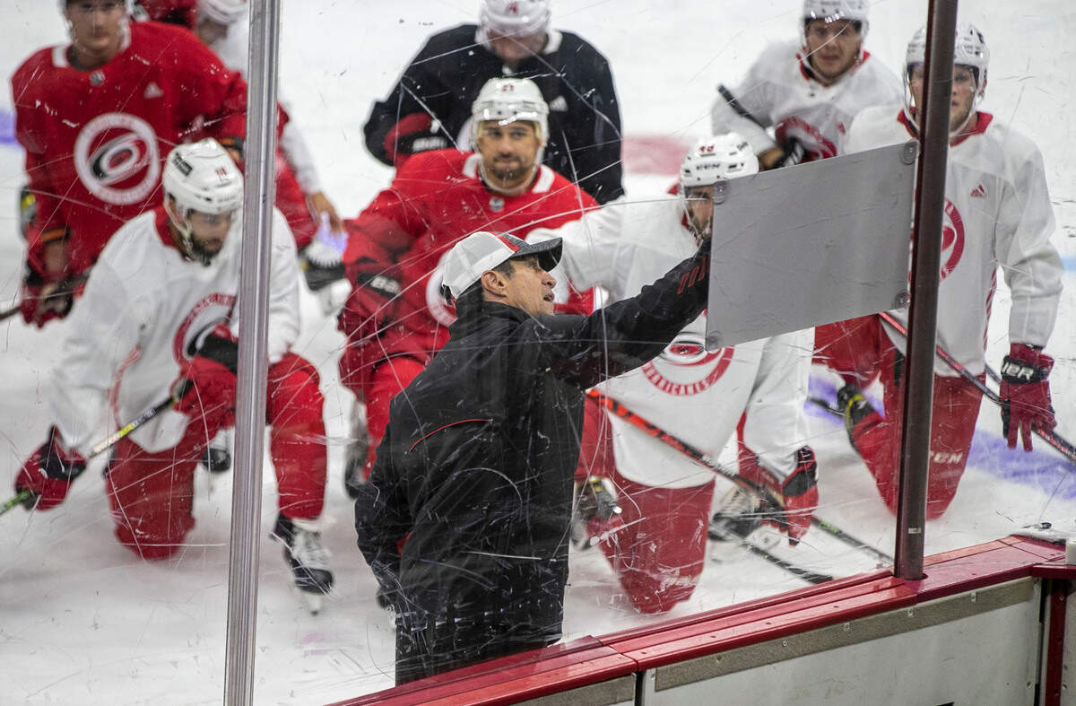 Carolina Hurricanes coach Rod Brind’Amour works with his players during the opening day of training camp on Thursday, September 23, 2021 at PNC Arena in Raleigh, N.C.