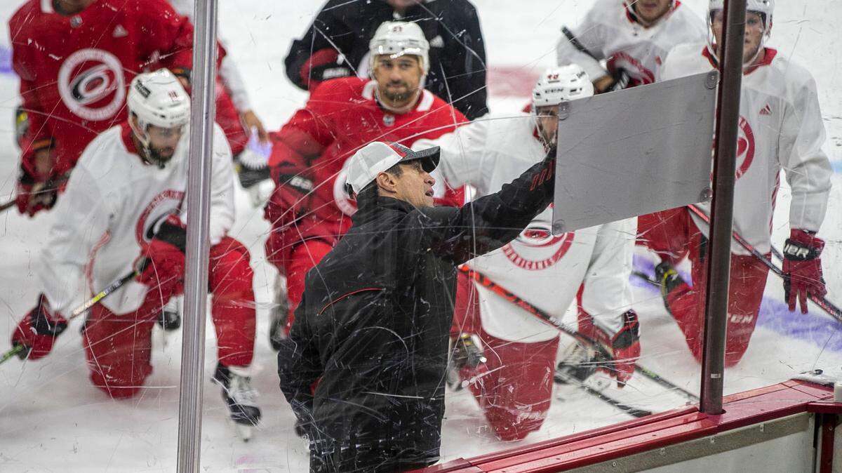 Carolina Hurricanes coach Rod Brind’Amour works with his players during the opening day of training camp on Thursday, September 23, 2021 at PNC Arena in Raleigh, N.C.