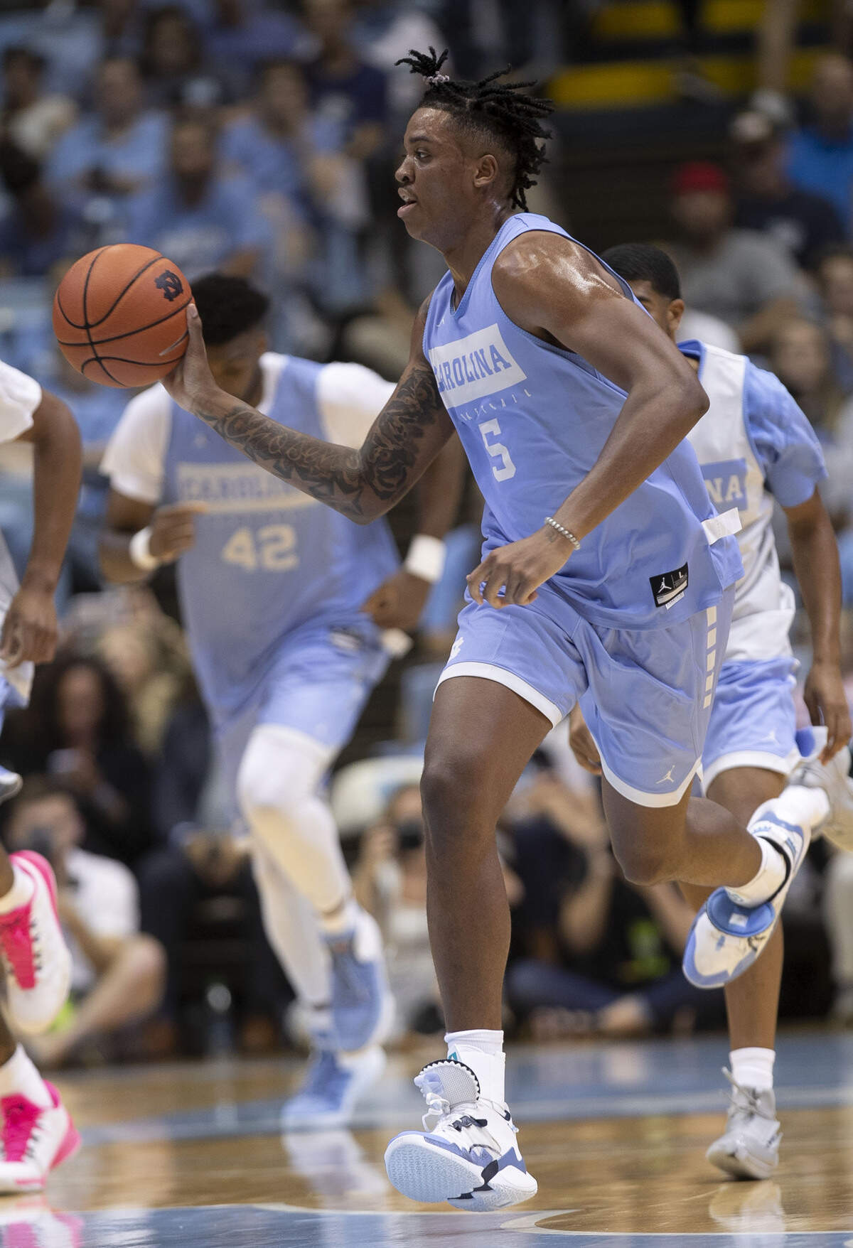 North Carolina freshman Armando Bacot (5) leads a fast break during the scrimmage at the annual Late Night with Roy Williams kickoff to the basketball season on Friday, September 27, 2019 at the Smith Center in Chapel Hill, N.C.