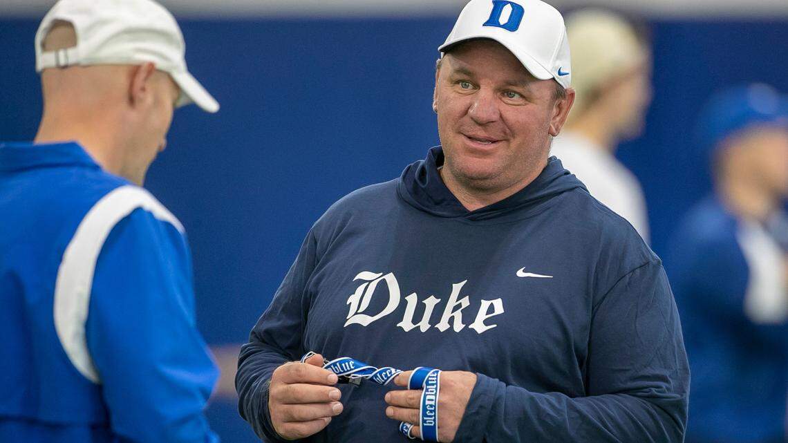 Duke head coach Mike Elko talks with offensive coordinator Kevin Johns during the Blue Devils’ spring practice on Friday, March 24, 2023 in Durham, N.C.