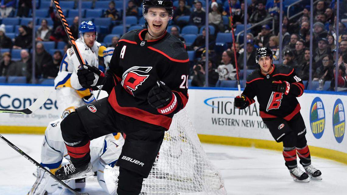 Carolina Hurricanes center Sebastian Aho (20) celebrates after scoring against the Buffalo Sabres during the first period of an NHL hockey game in Buffalo, N.Y., Wednesday, Feb. 1, 2023. (AP Photo/Adrian Kraus)