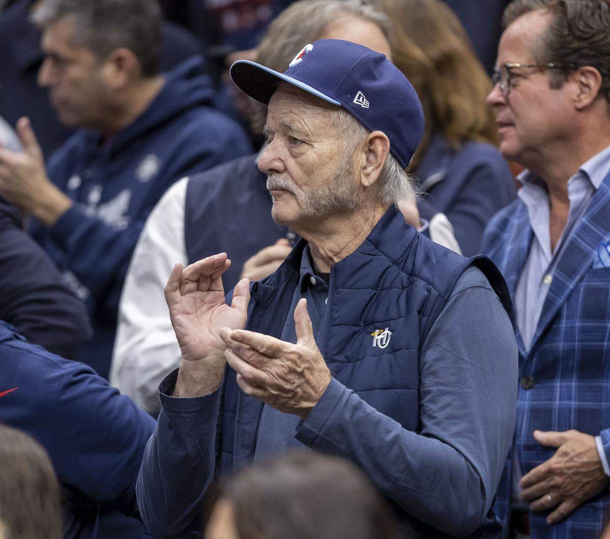 Bill Murray applauds the Connecticut Huskies as they take the court for their game against Duke on Sunday, March 29, 2026, in the NCAA East Regional Championship, at Capital One Arena in Washington, D.C.