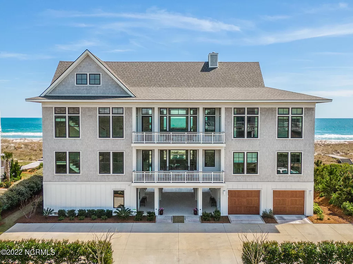 UNC football coach Mack Brown and his wife paid $9.5 million for a beach house on Figure Eight Island near Wilmington, according to property records dated May 19, 2022.